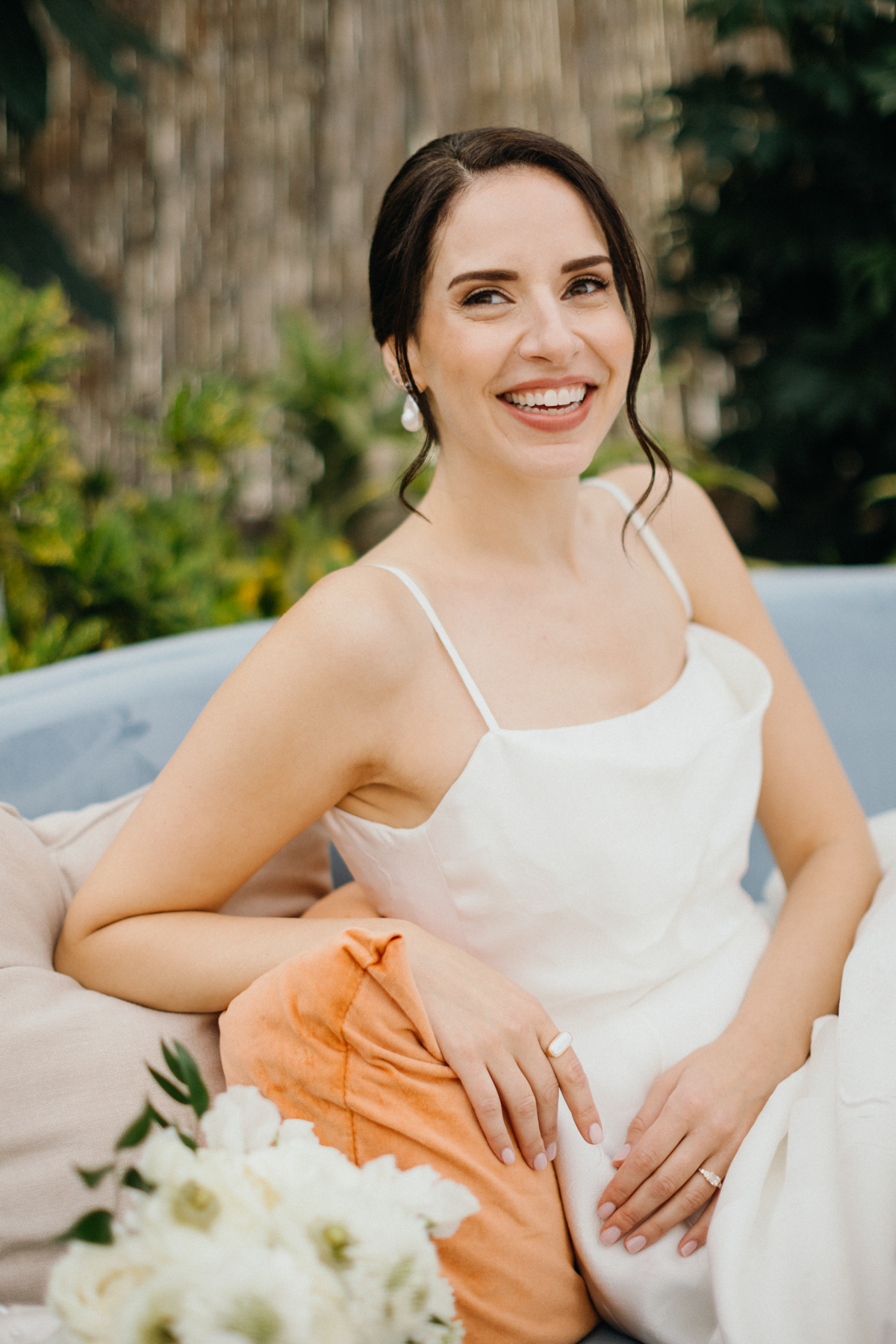 Solo portrait of the bride near the greenhouse garden entrance