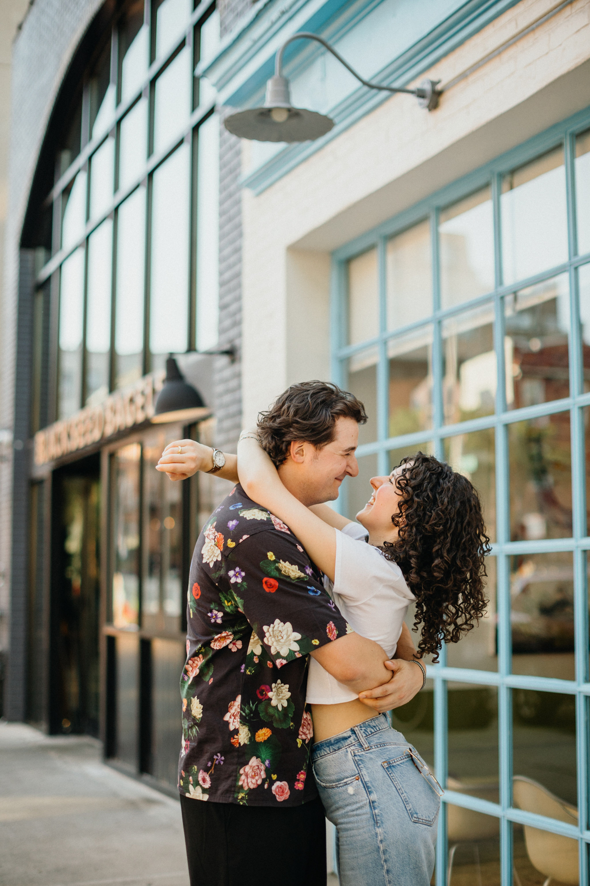 Medium format film photographer capturing a candid moment of the couple in Brooklyn’s streets.
