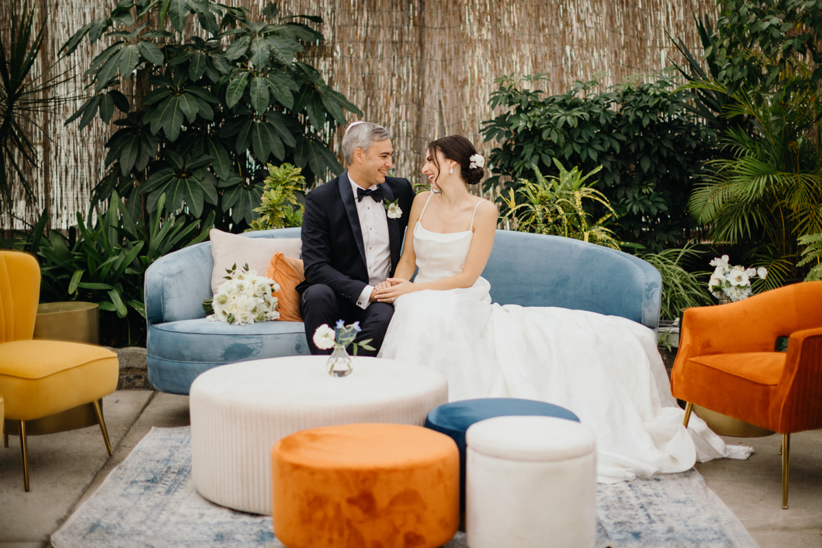 Editorial-style couple shot inside the Fairmount Park Horticulture Center