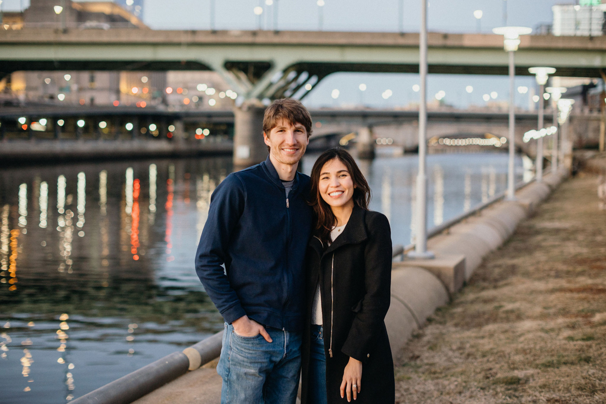Philly couples photographer capturing couple by riverfront in Queen Village