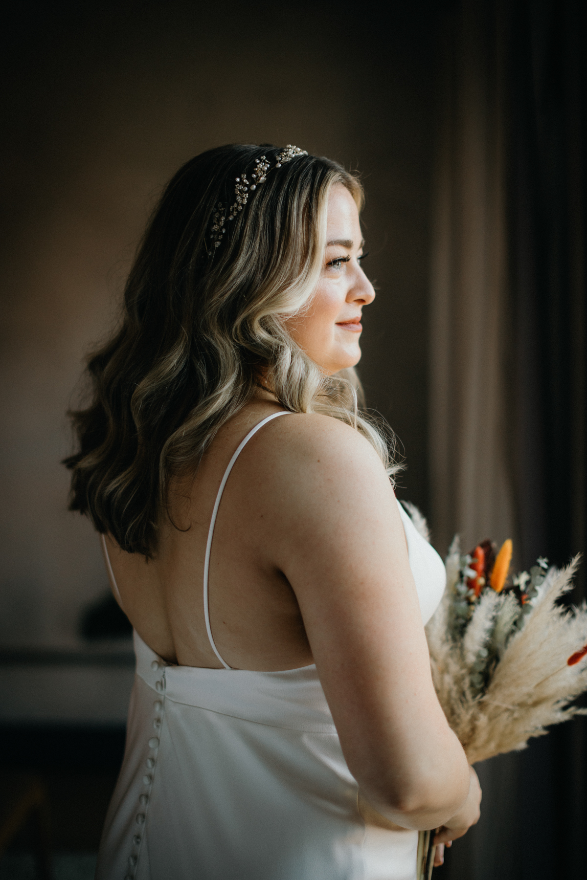 Bridal hair and makeup moment at Lokal Hotel by Philly wedding photographer
