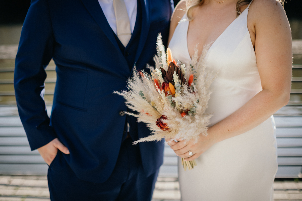 Romantic portraits at Race Street Pier with Philly skyline in backgrou