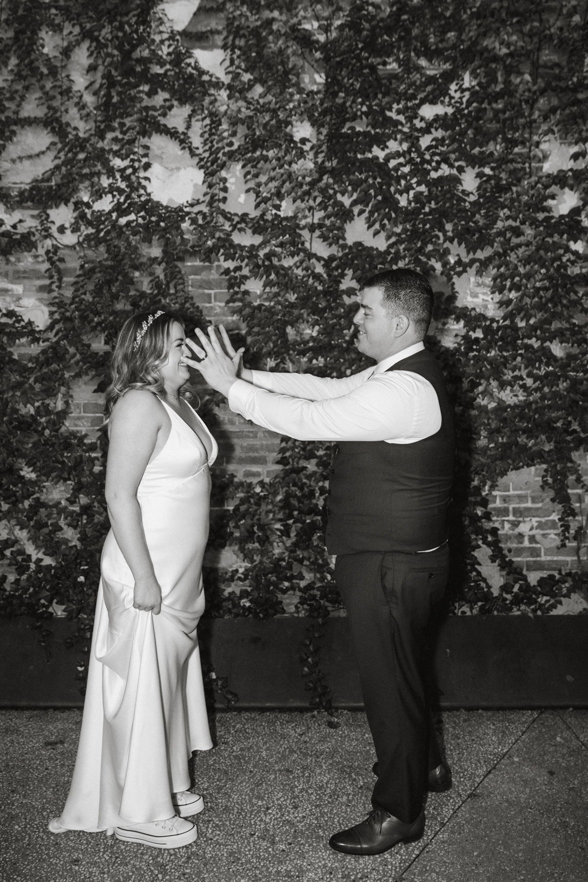 Black and white reception photo with strong lighting and emotion