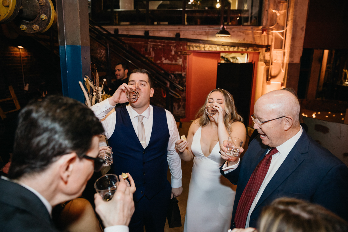 Wedding guests mingling among disco balls and candlelight