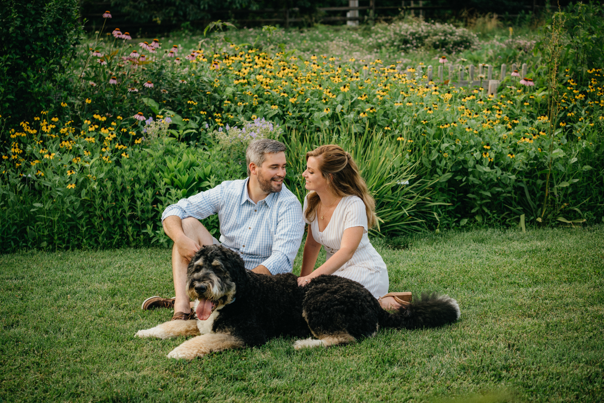 Romantic engagement photo by river at Bartram’s Garden