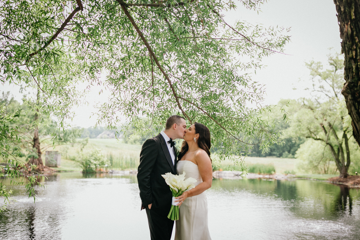 Farm at Eagles Ridge wedding photo showing a couple by the pond, waterfront wedding venue in Philadelphia