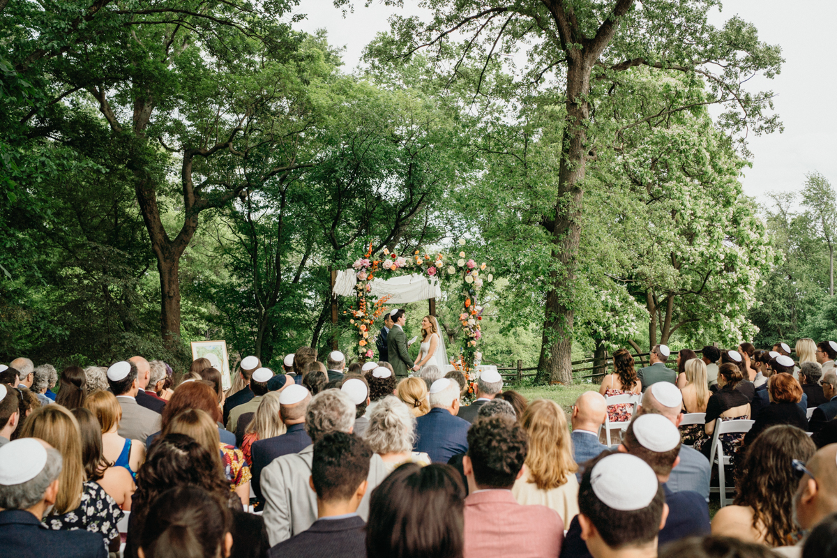 Bartram’s Garden wedding photo showing ceremony setup with river views, waterfront wedding venue in Philadelphia