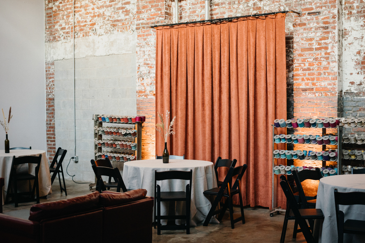 Philly wedding photographer captures industrial wedding reception with fall tones