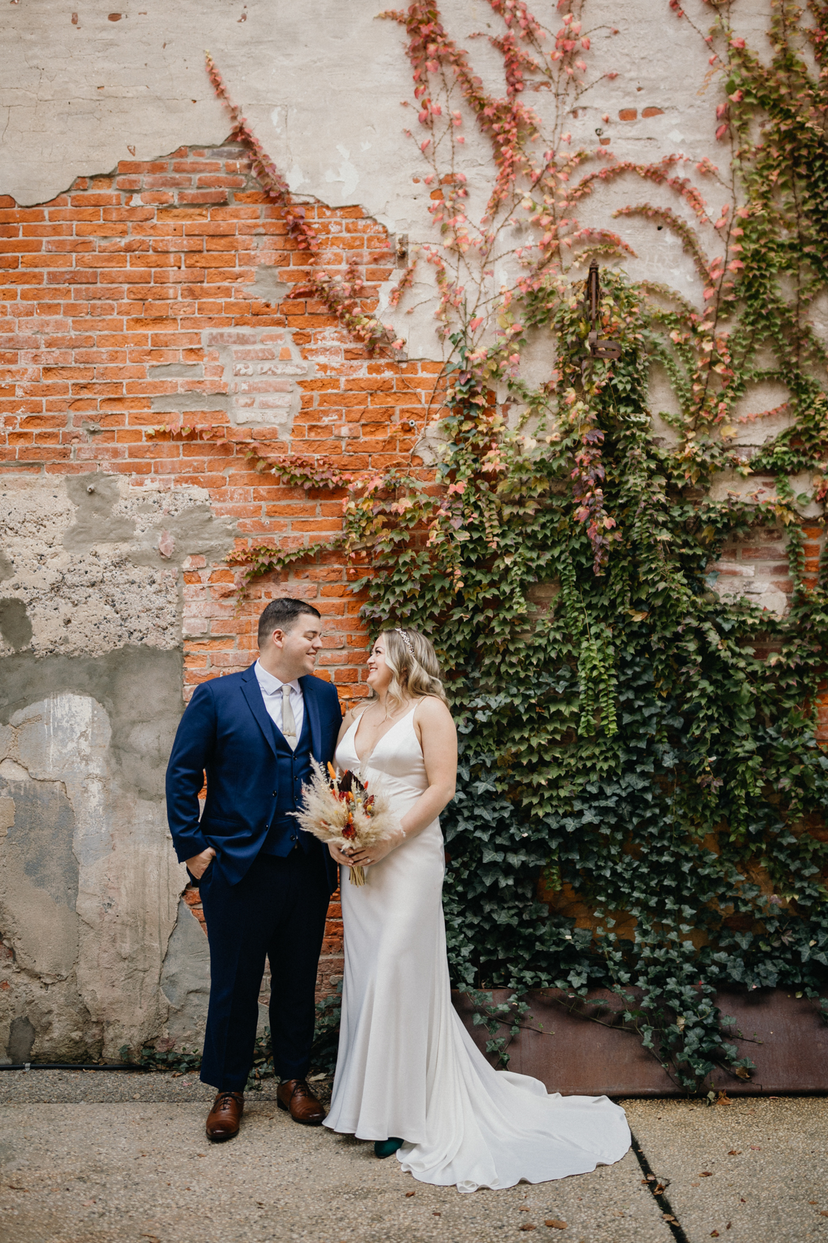 Editorial wedding portrait inside Global Dye Works with industrial textures