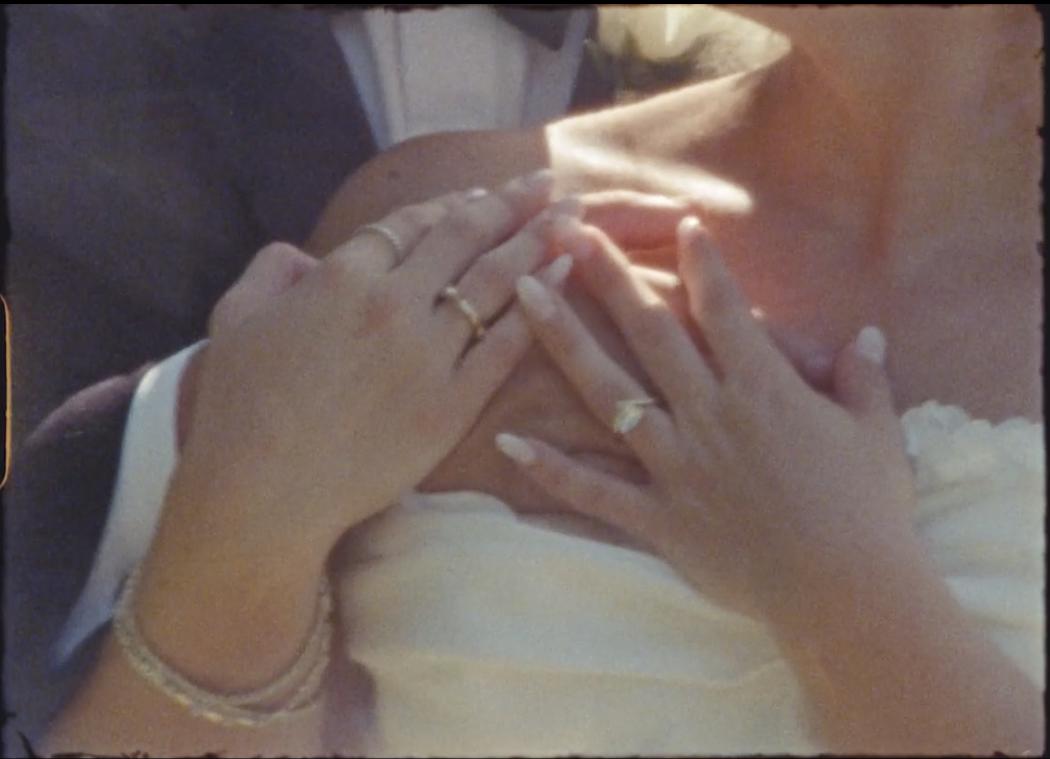 Close up of bride and groom's hand shot on Super 8 film 