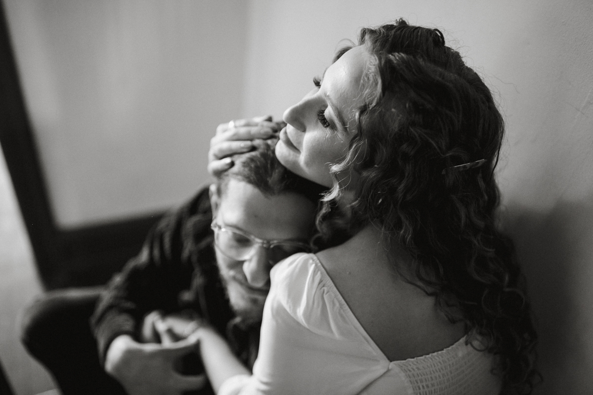 Candid indoor couples photo in natural light