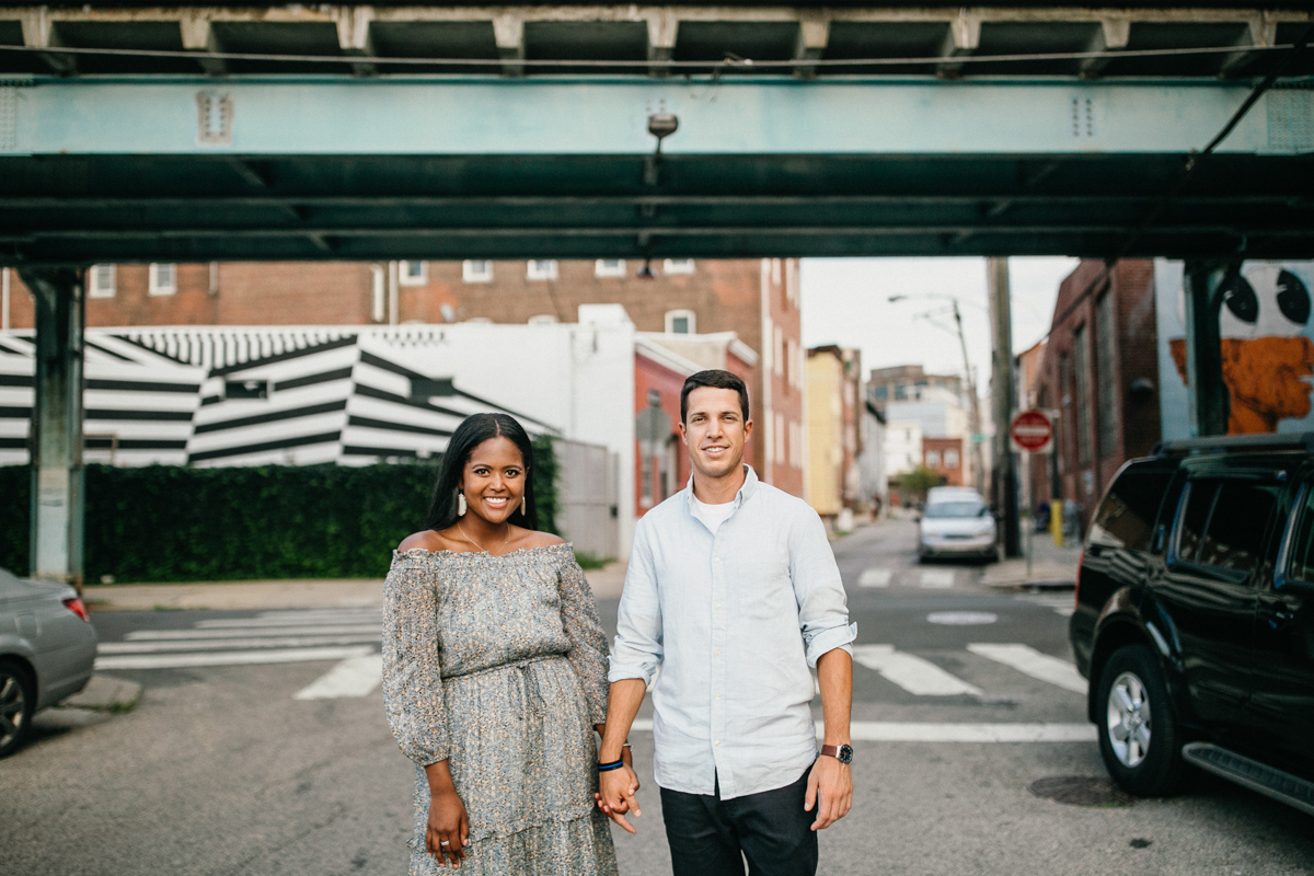 Street style engagement photo walking through Fishtown