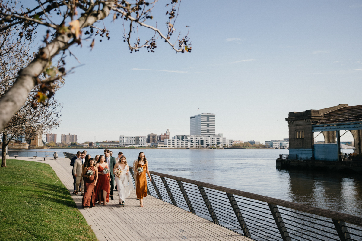 Wedding party portraits with Ben Franklin Bridge in the background