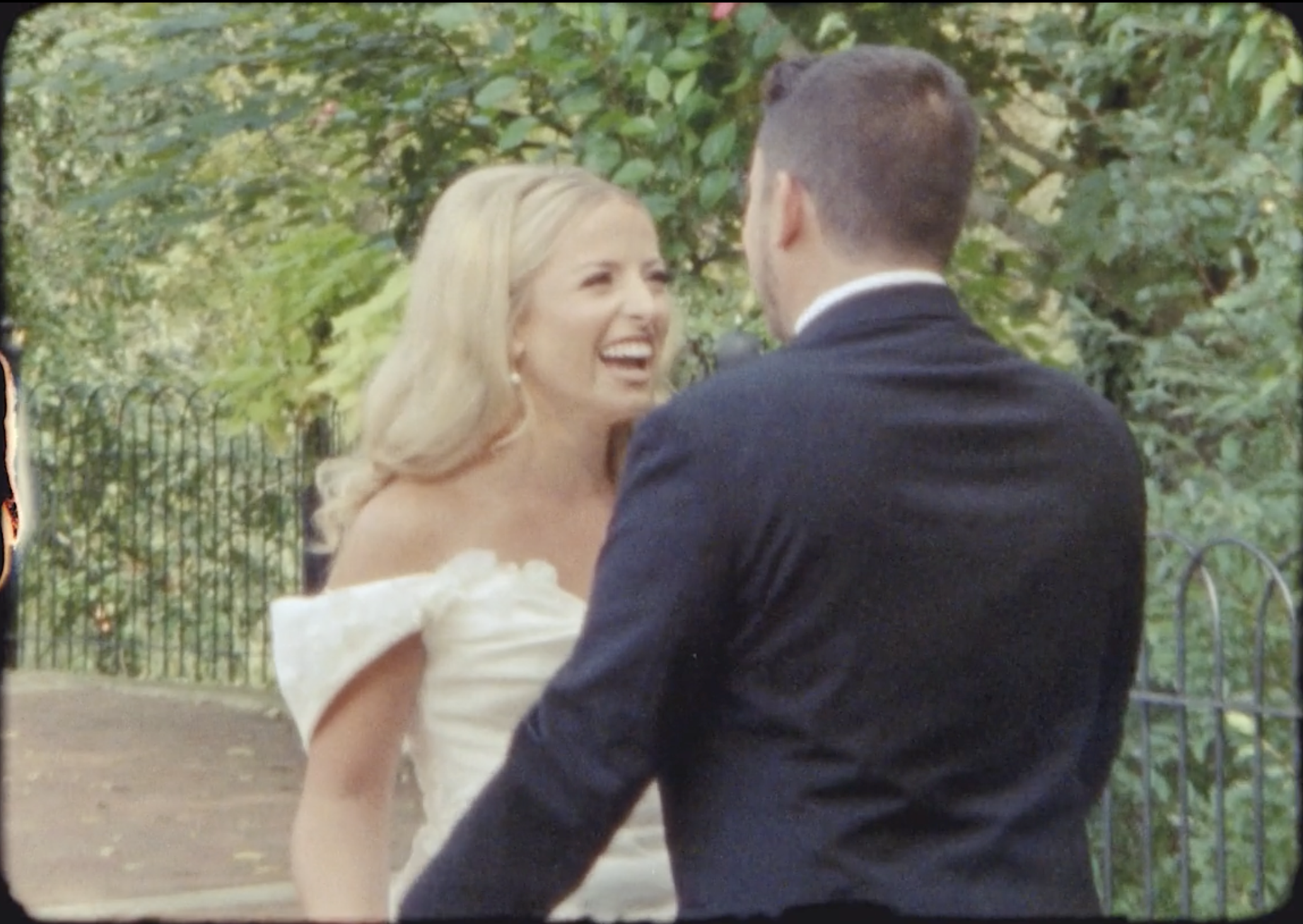 Candid moment of the bride laughing during wedding vows
