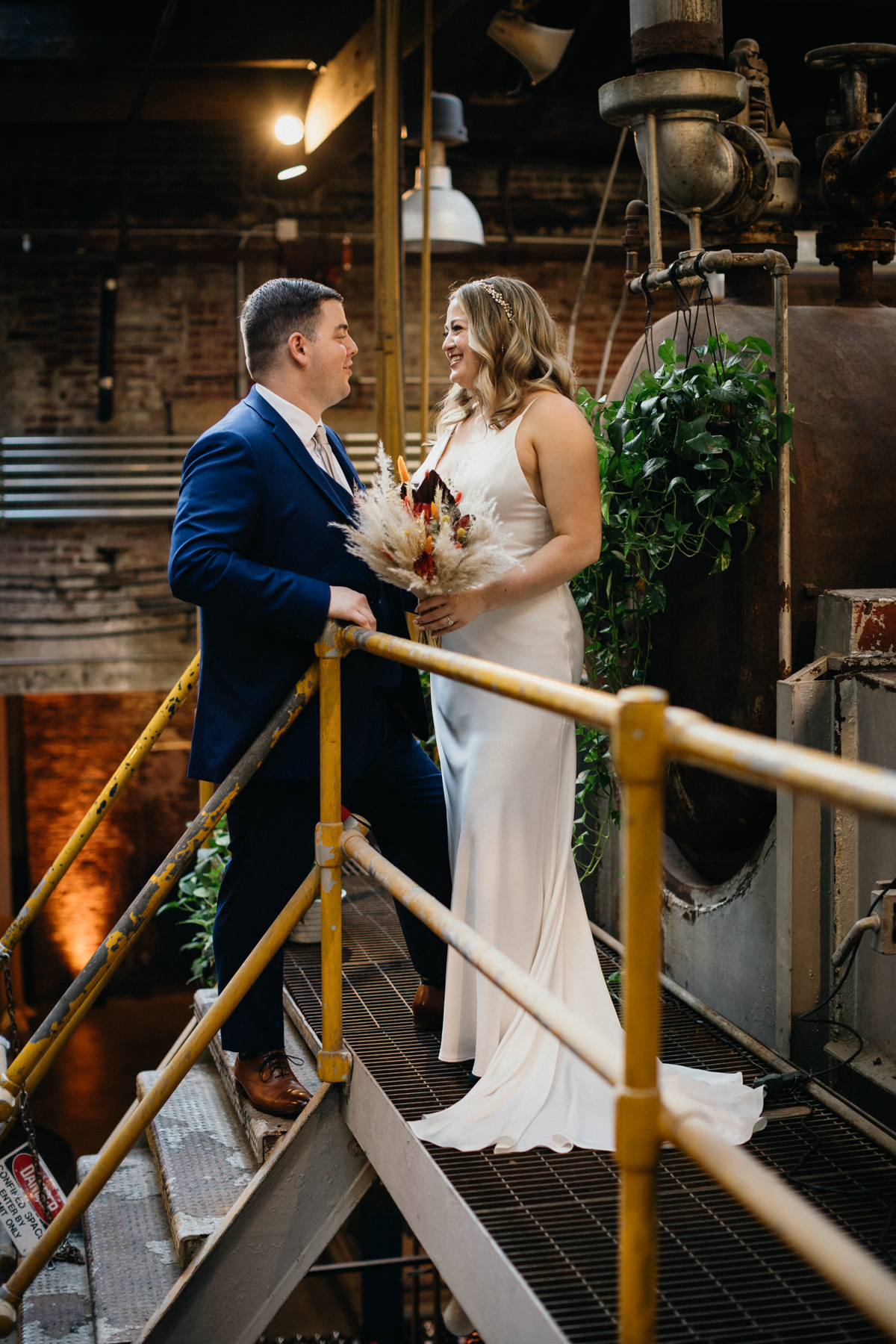 Global Dye Works wedding portrait in factory space with dramatic shadows
