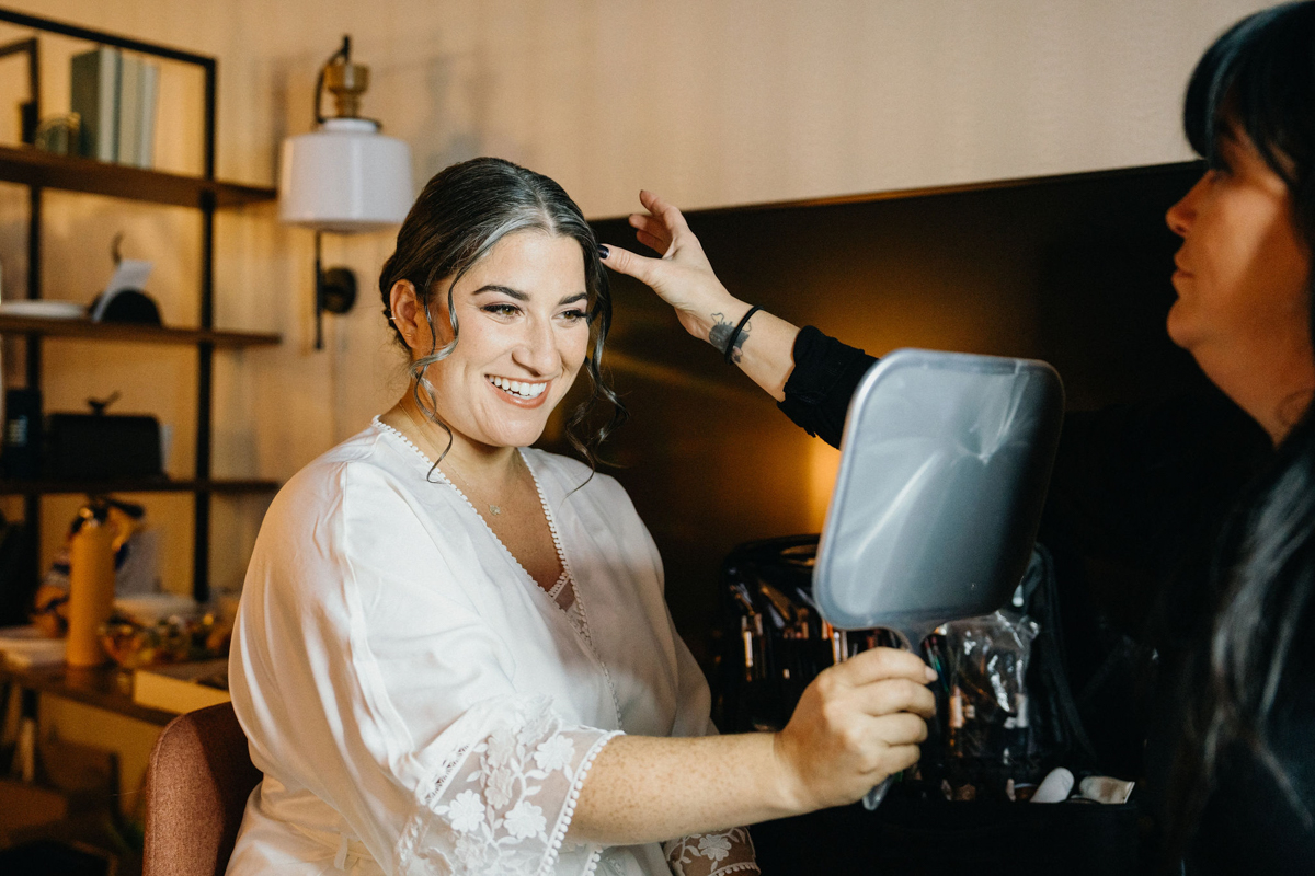 Getting ready in hotel by Philly wedding videographer
