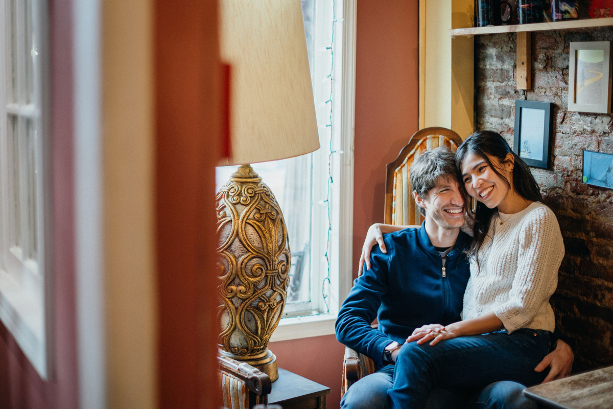 Philadelphia couples photographer photographing couple by quaint neighborhood café