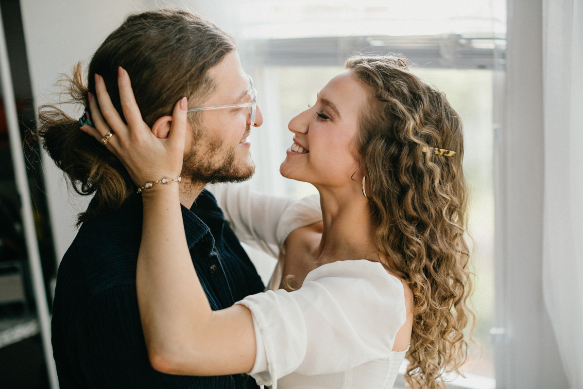 Candid indoor couples photo in natural light