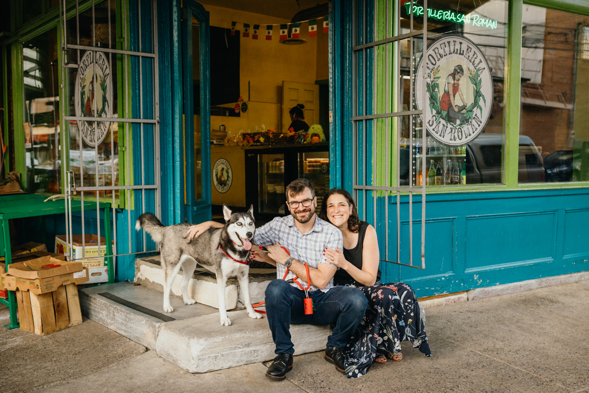 Couple smiling outside tattoo shop in South Philly