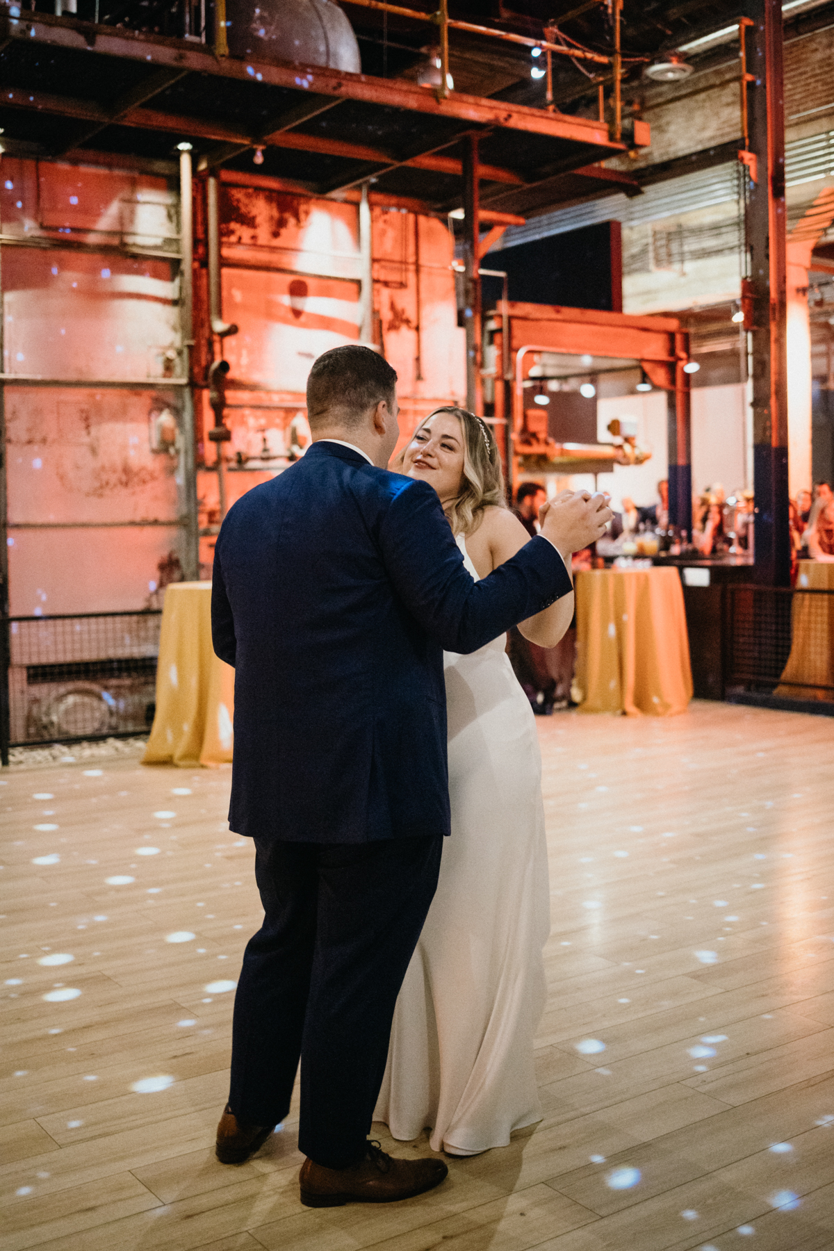 Philly wedding photographer captures newlyweds’ first dance in factory space