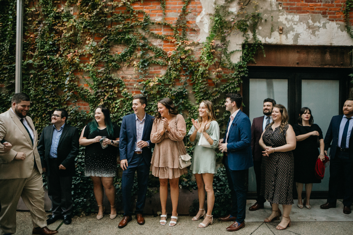 Guests gather for outdoor ceremony at industrial Philadelphia wedding venue