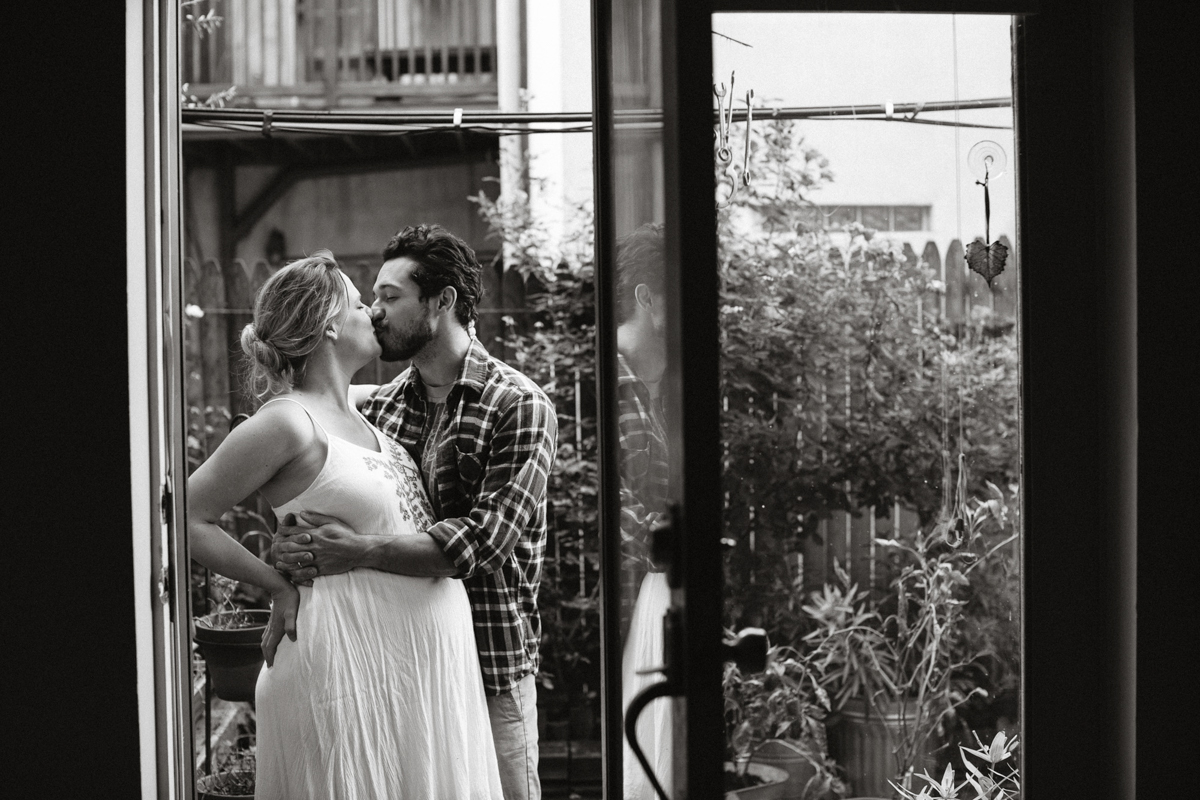 mom and dad in garden for maternity session