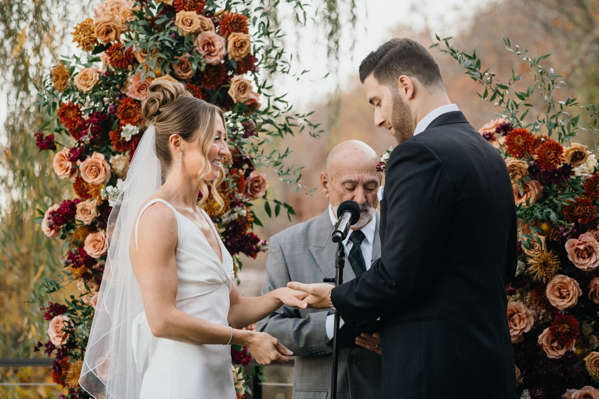 fall wedding ceremony at odettes waterfront deck