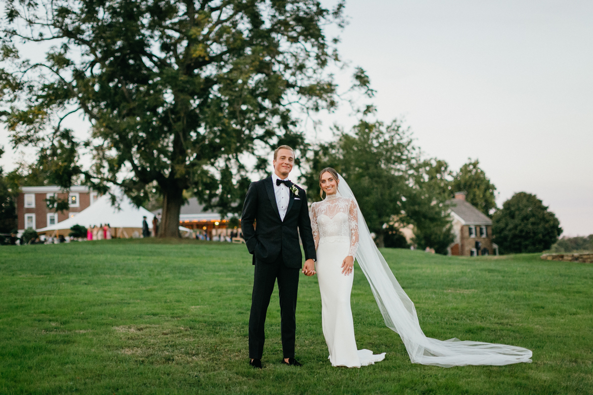 Bride and groom with paddock views at Radnor Hunt