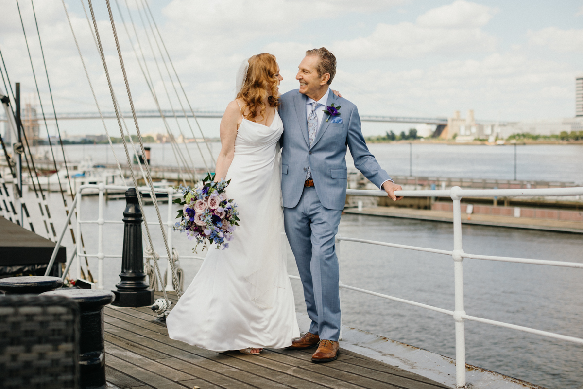 Couple celebrating on the top deck of Moshulu