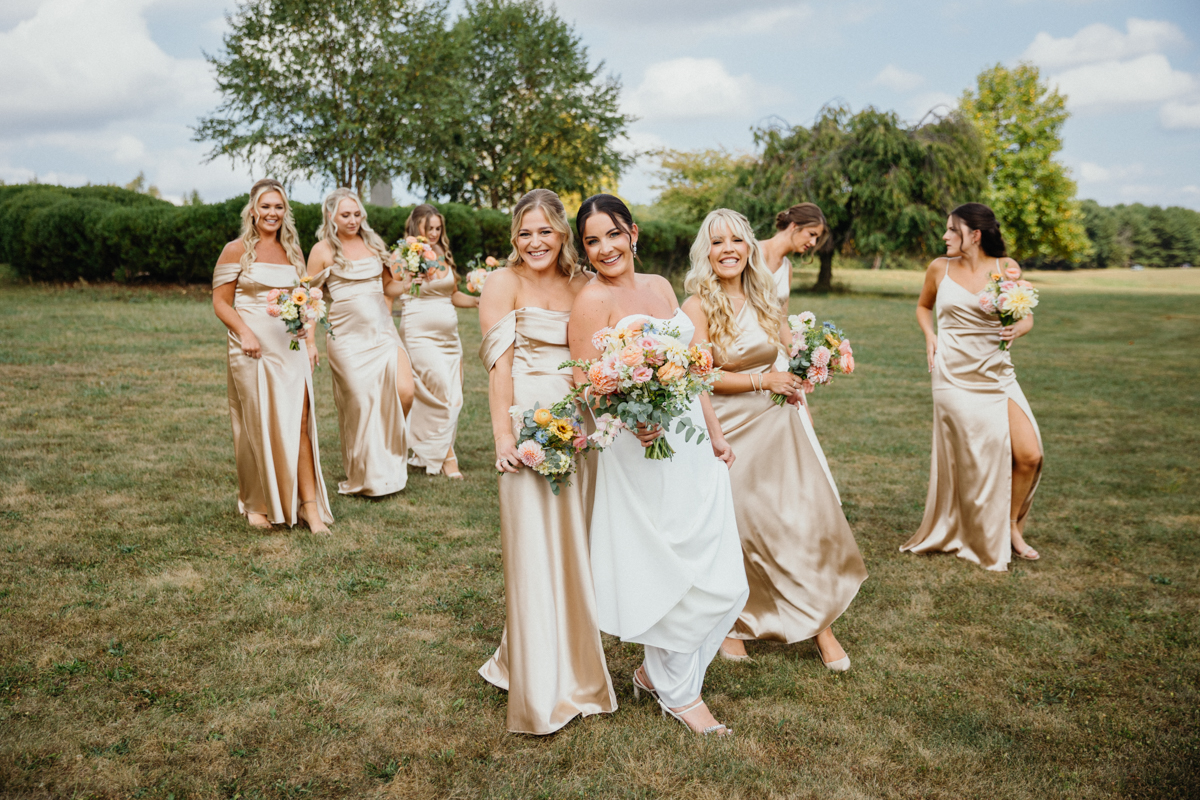 Joyful candid moment at Terrain Gardens at DelVal wedding