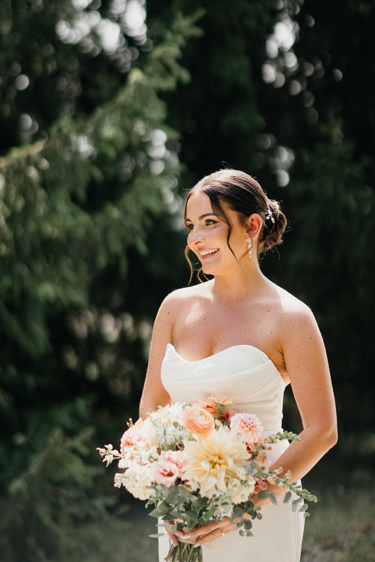 Bride holding bouquet at Terrain Gardens at DelVal wedding