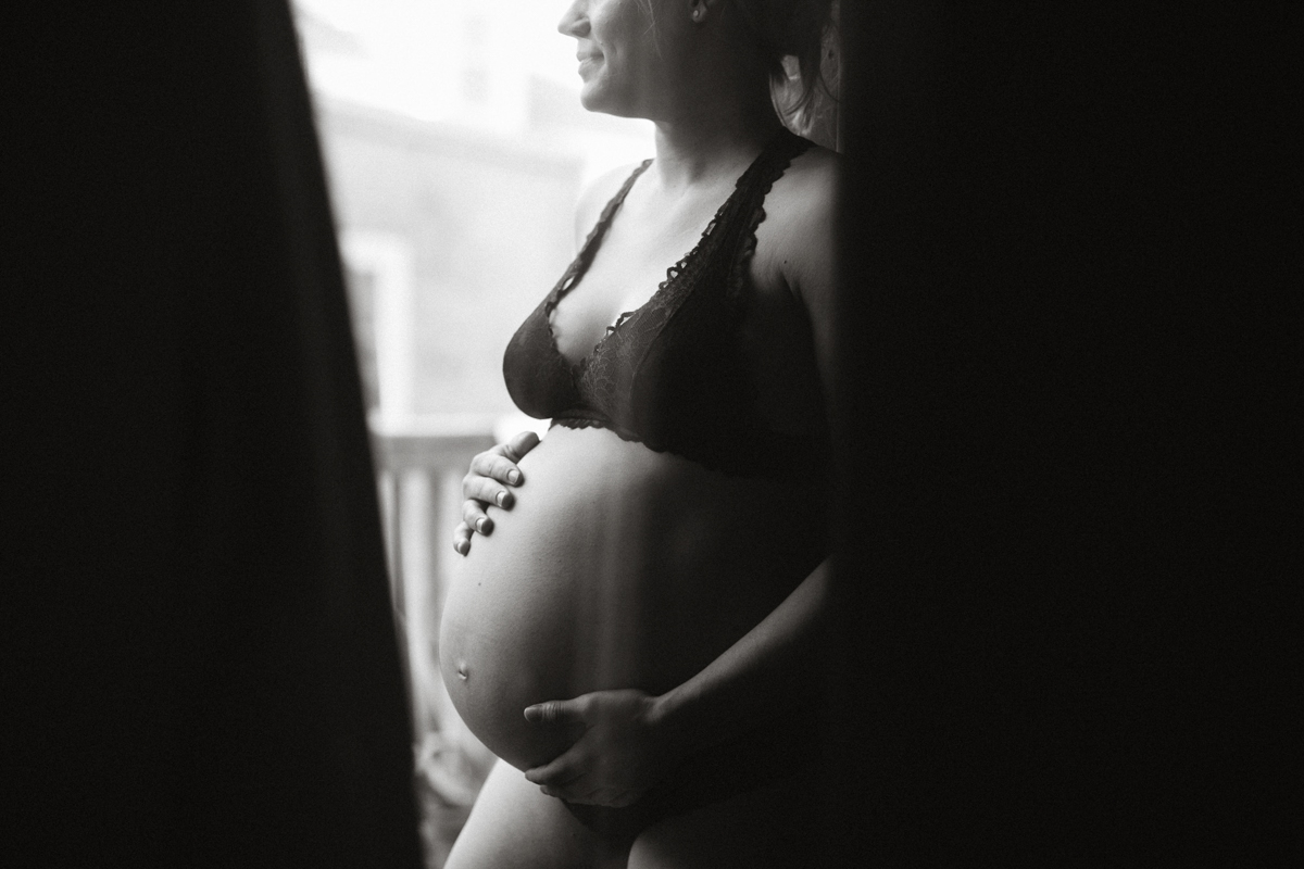 Close-up maternity photo with floral background in Philadelphia