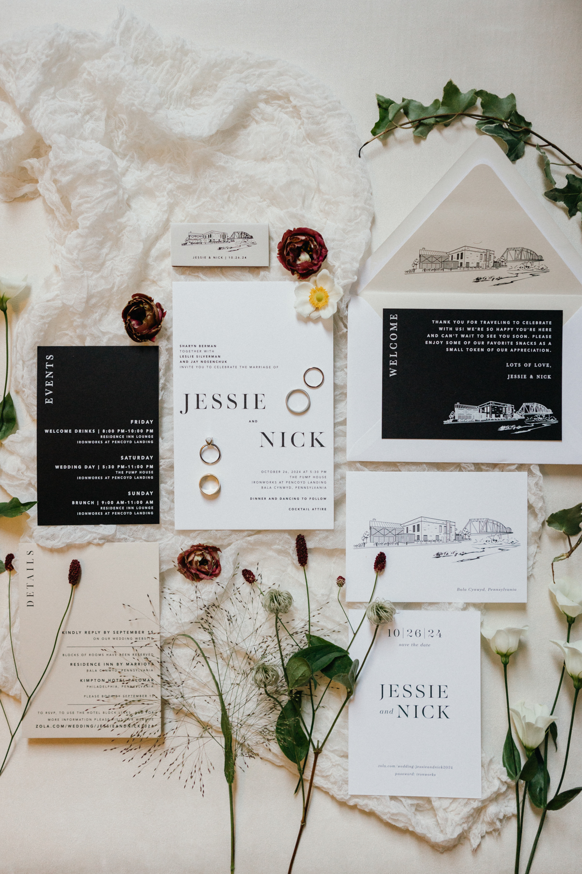 Black and white wedding invitation suite styled with florals