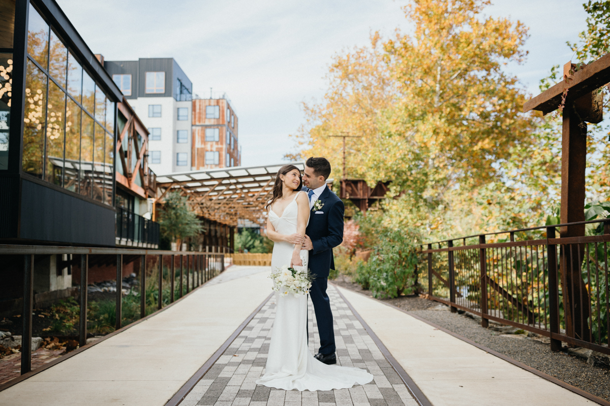Quiet moment between couple in industrial corridor