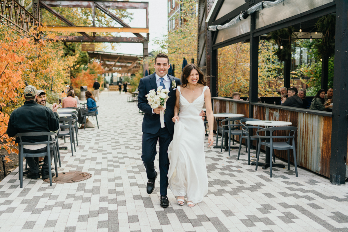 Couple framed by raw iron textures at Ironworks wedding