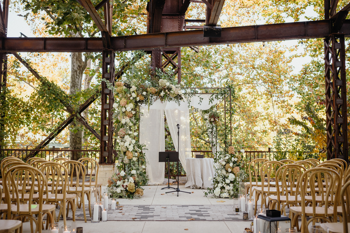 Ceremony site with industrial backdrop and lush florals