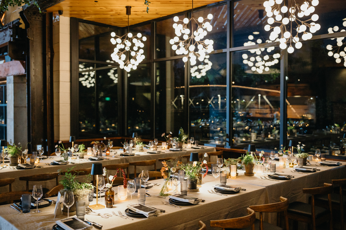 Chandeliers and greenery draped at Ironworks wedding reception