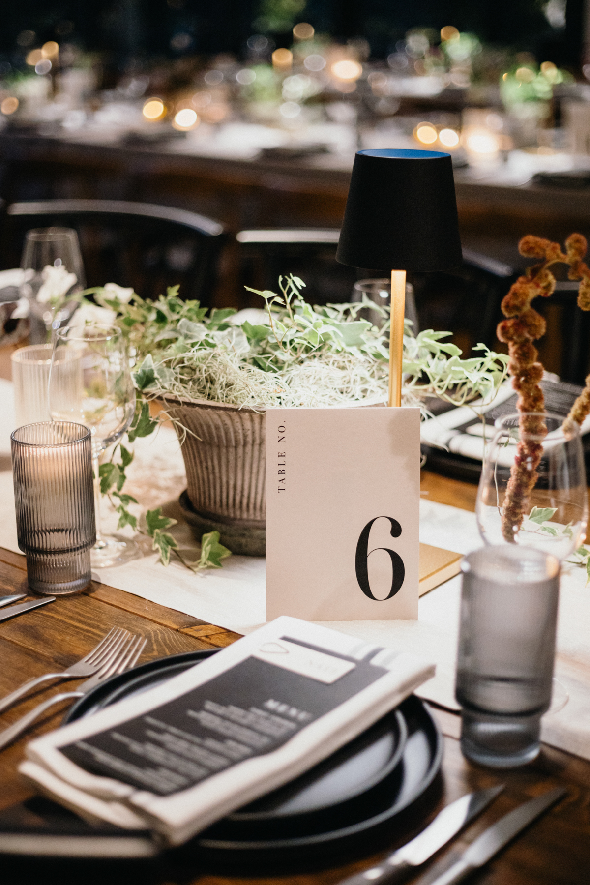 Modern wedding table decor with monochrome florals at Pumphouse