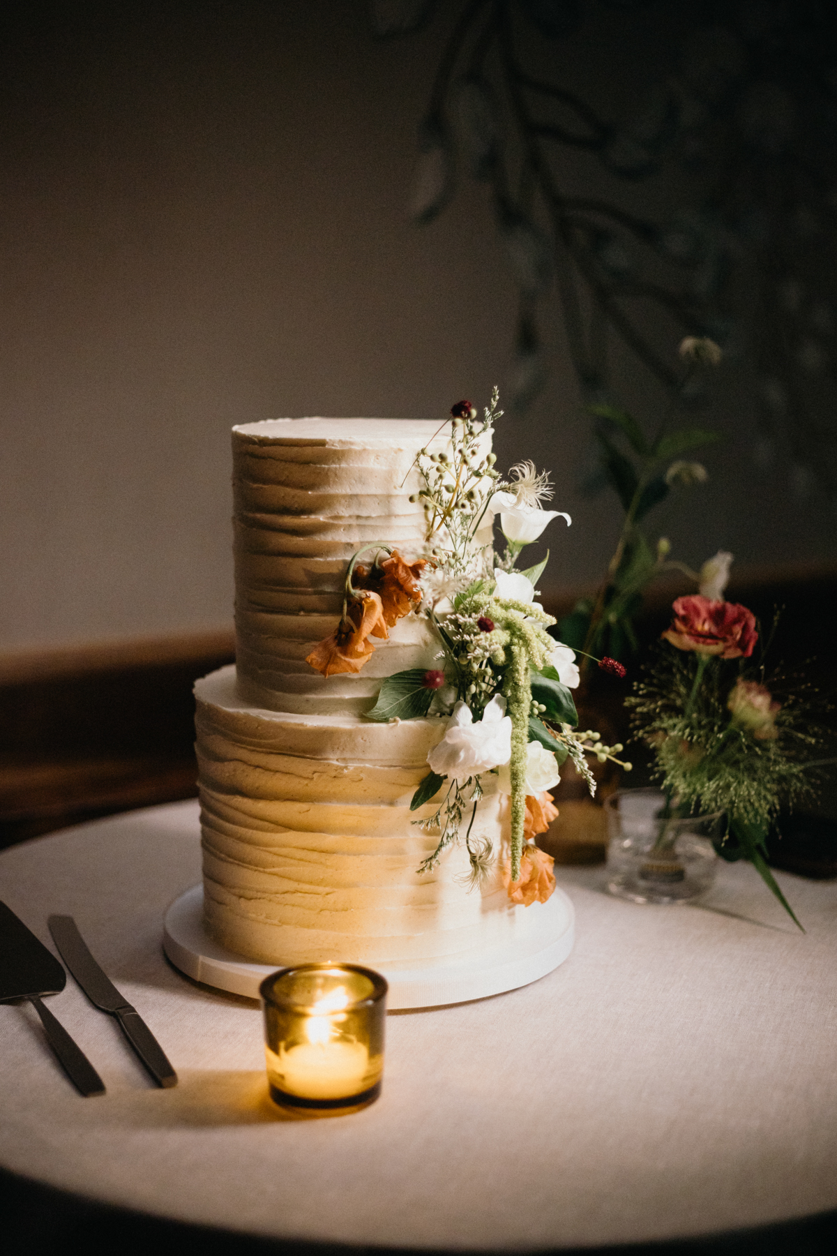 Wedding cake styled with florals at Pencoyd Landing reception