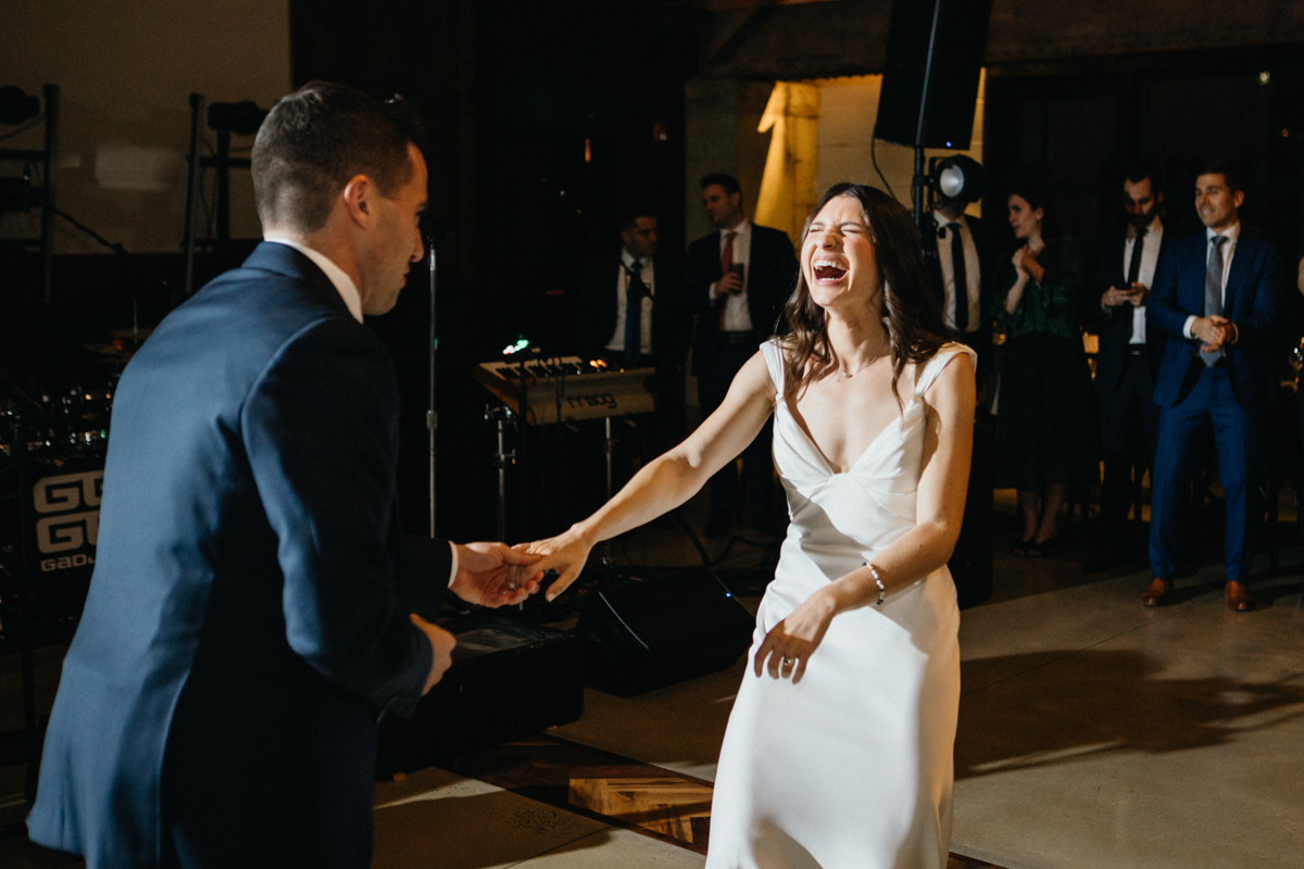 Couple sharing private moment on reception dance floor