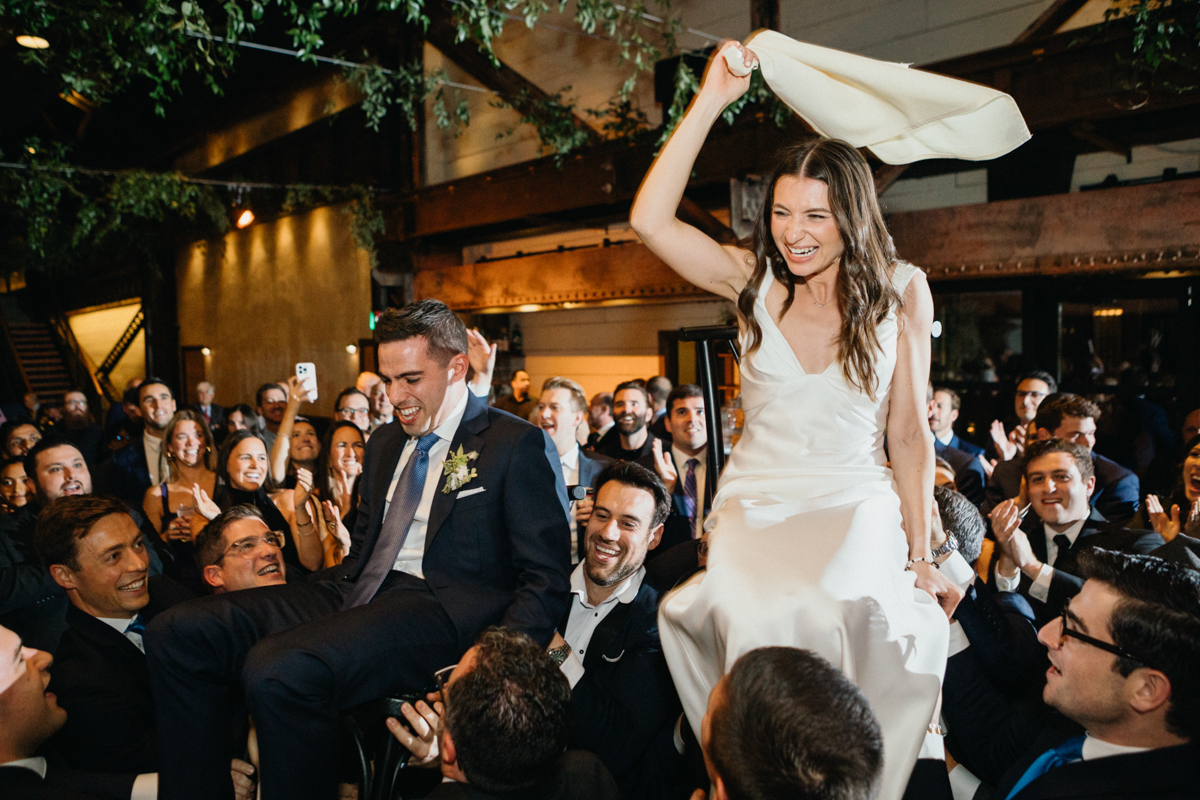 Joyful wedding party celebration at Ironworks reception