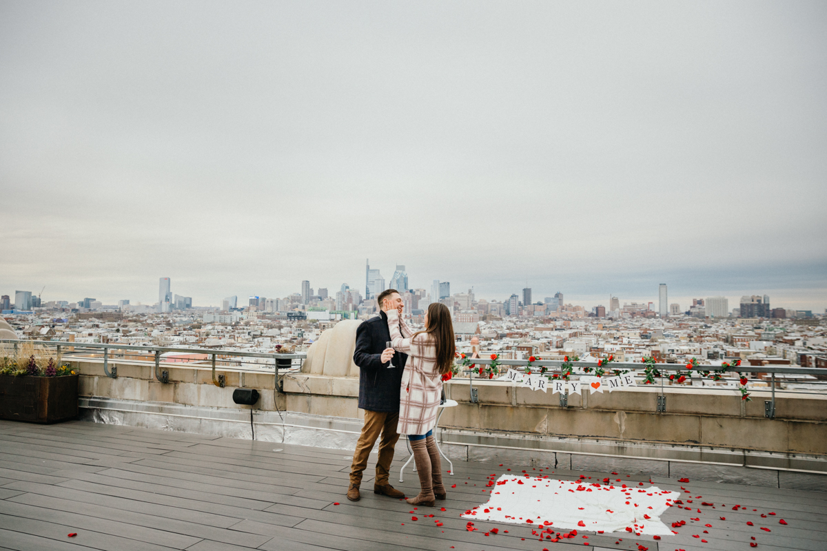 Romantic rooftop engagement on a winter day in Philadelphia