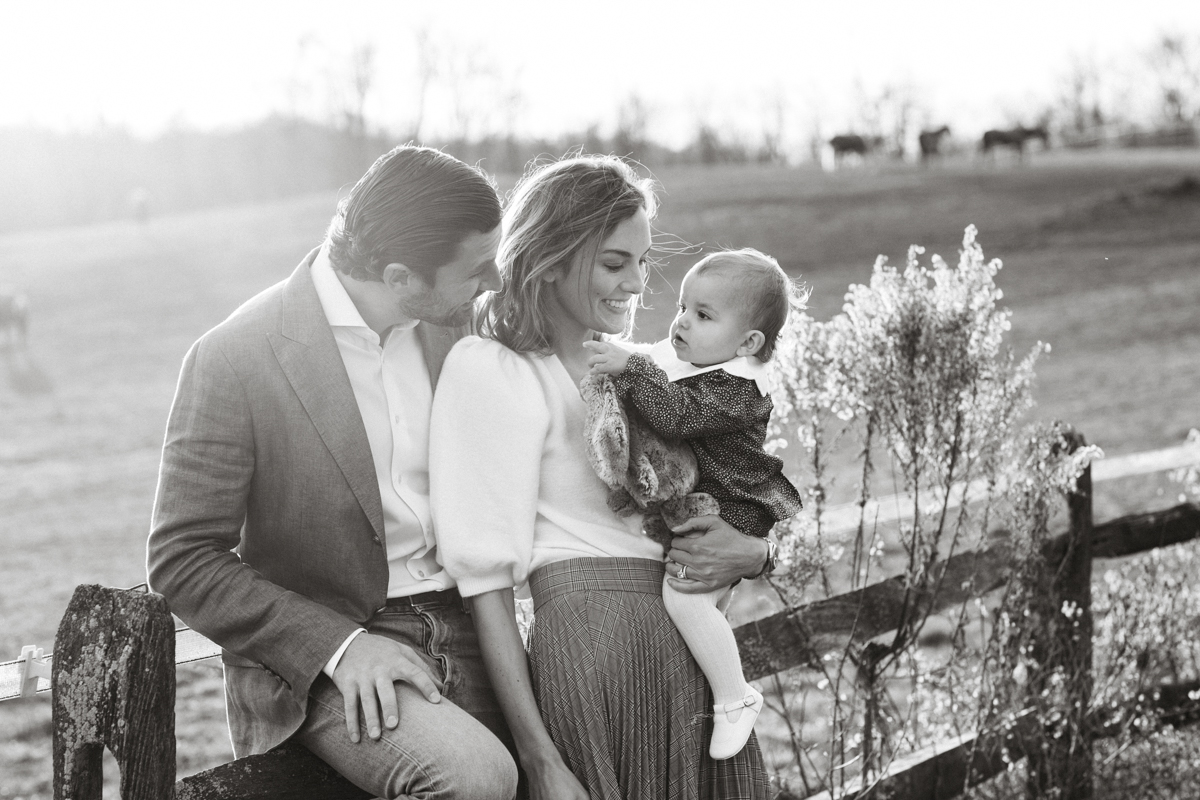 Philadelphia baby photographer parents holding one-year-old daughter