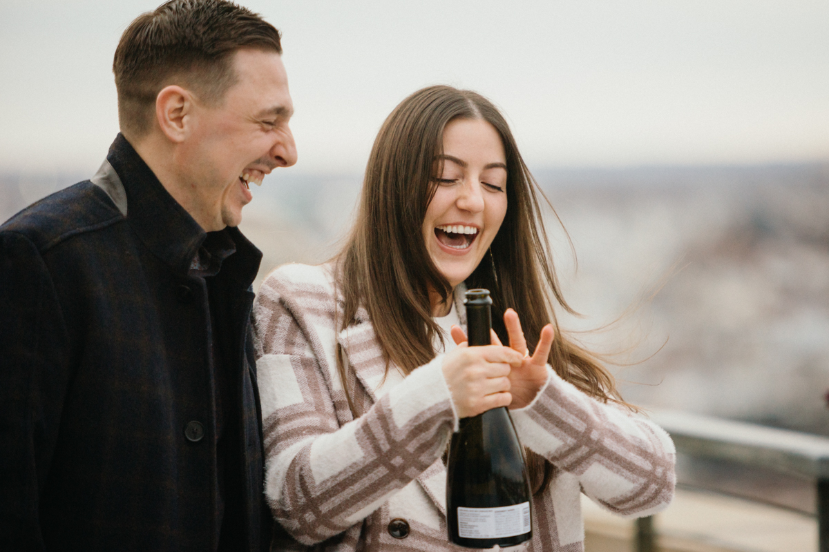 Scenic Bok rooftop proposal with champagne toast