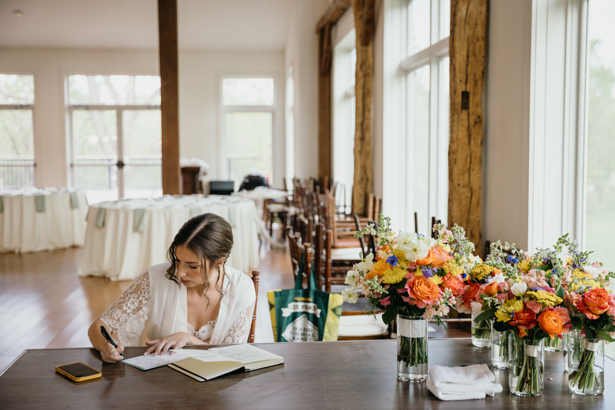 candid wedding photography - bride writing morning vows