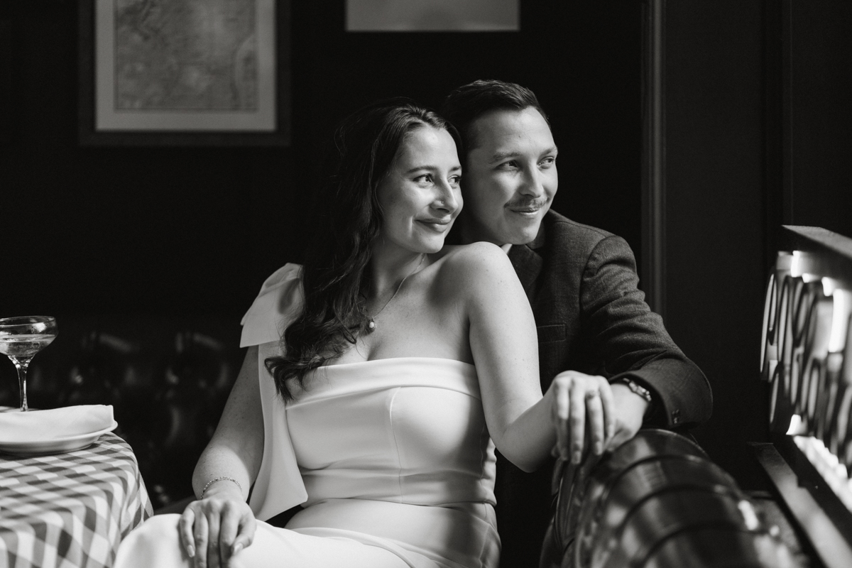 Black and white restaurant engagement portrait at PJ Clark’s