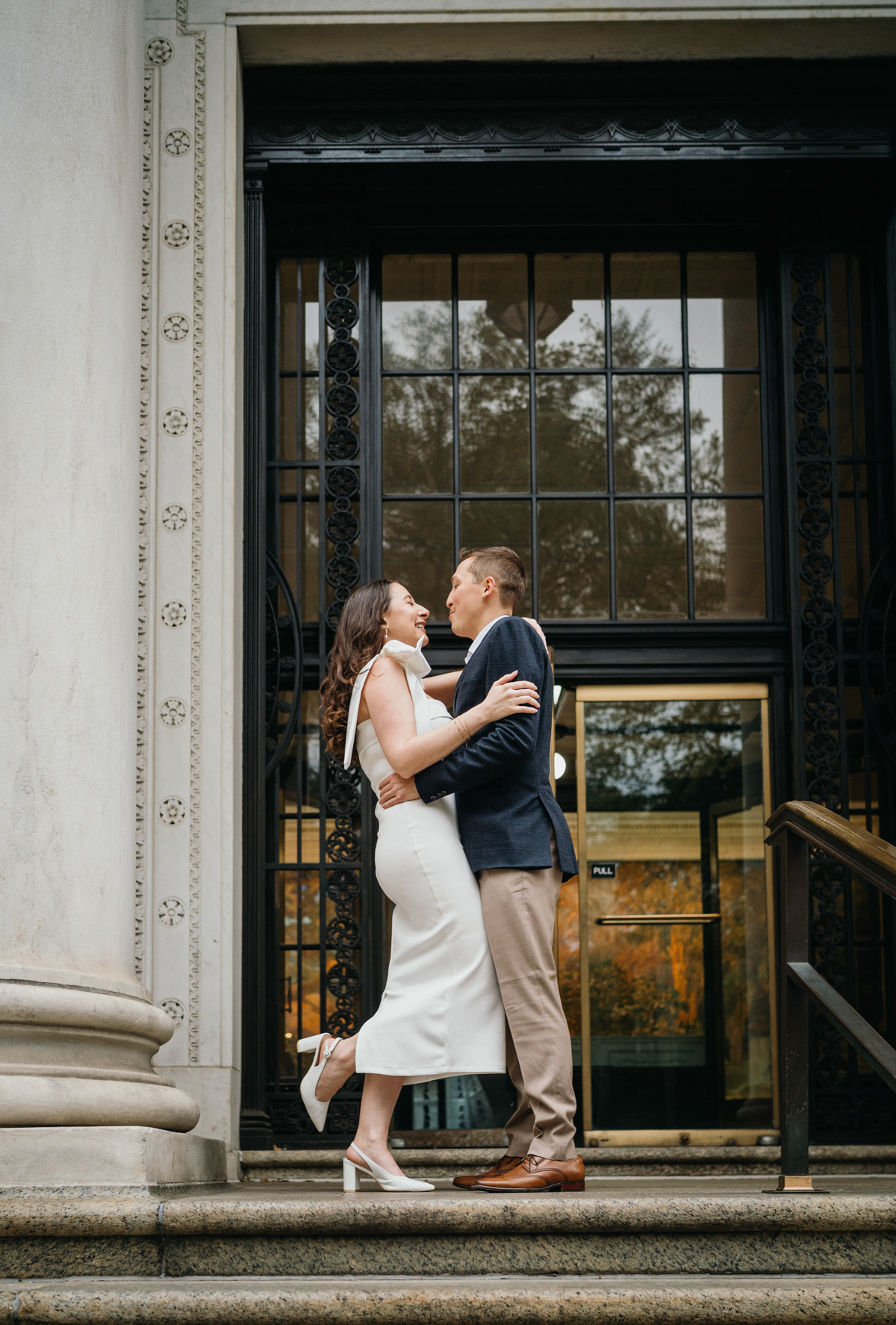Wide shot Philadelphia engagement photos at City Hall entrance