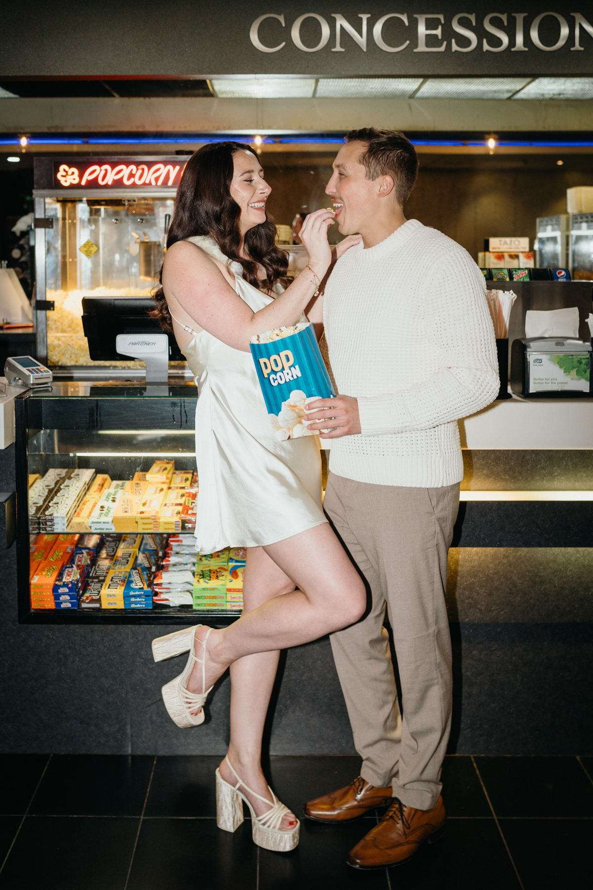 Cozy movie theater engagement portrait in Philly
