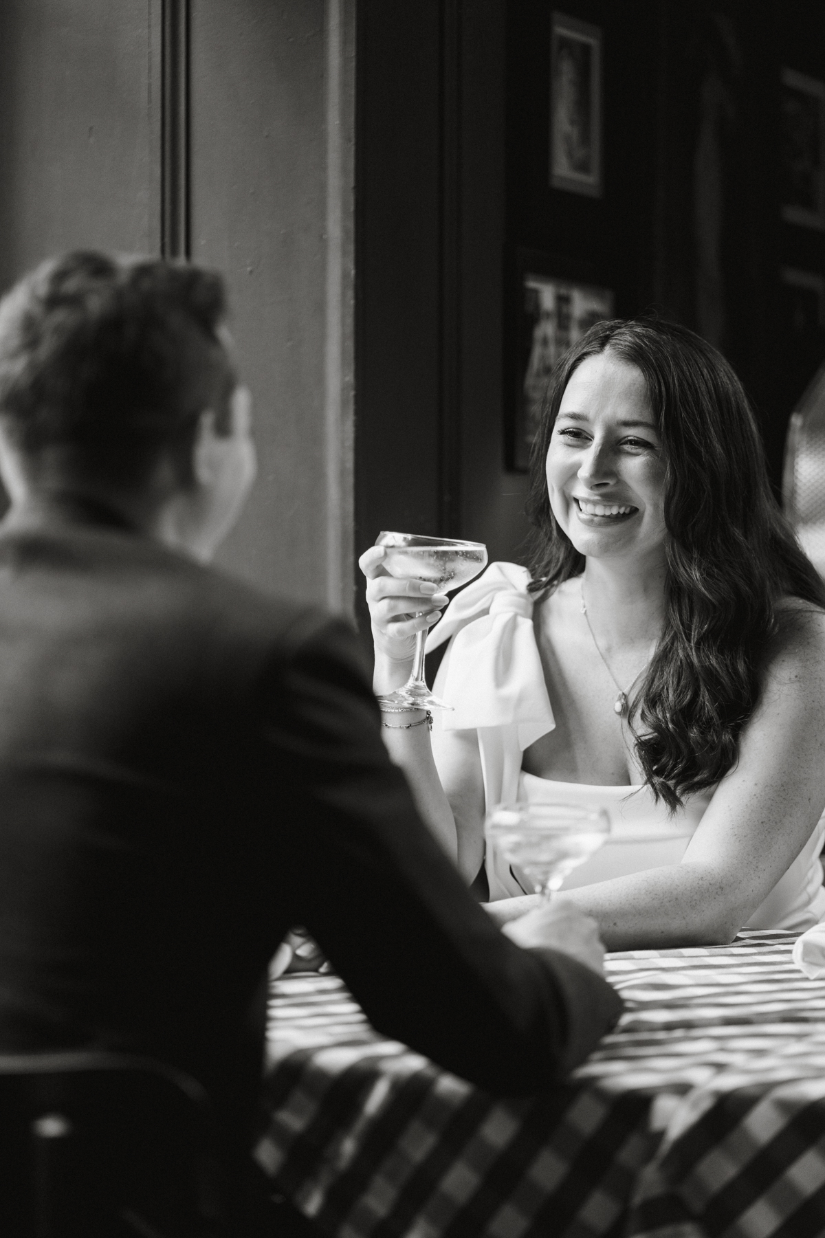Black and white restaurant engagement photo in Philadelphia