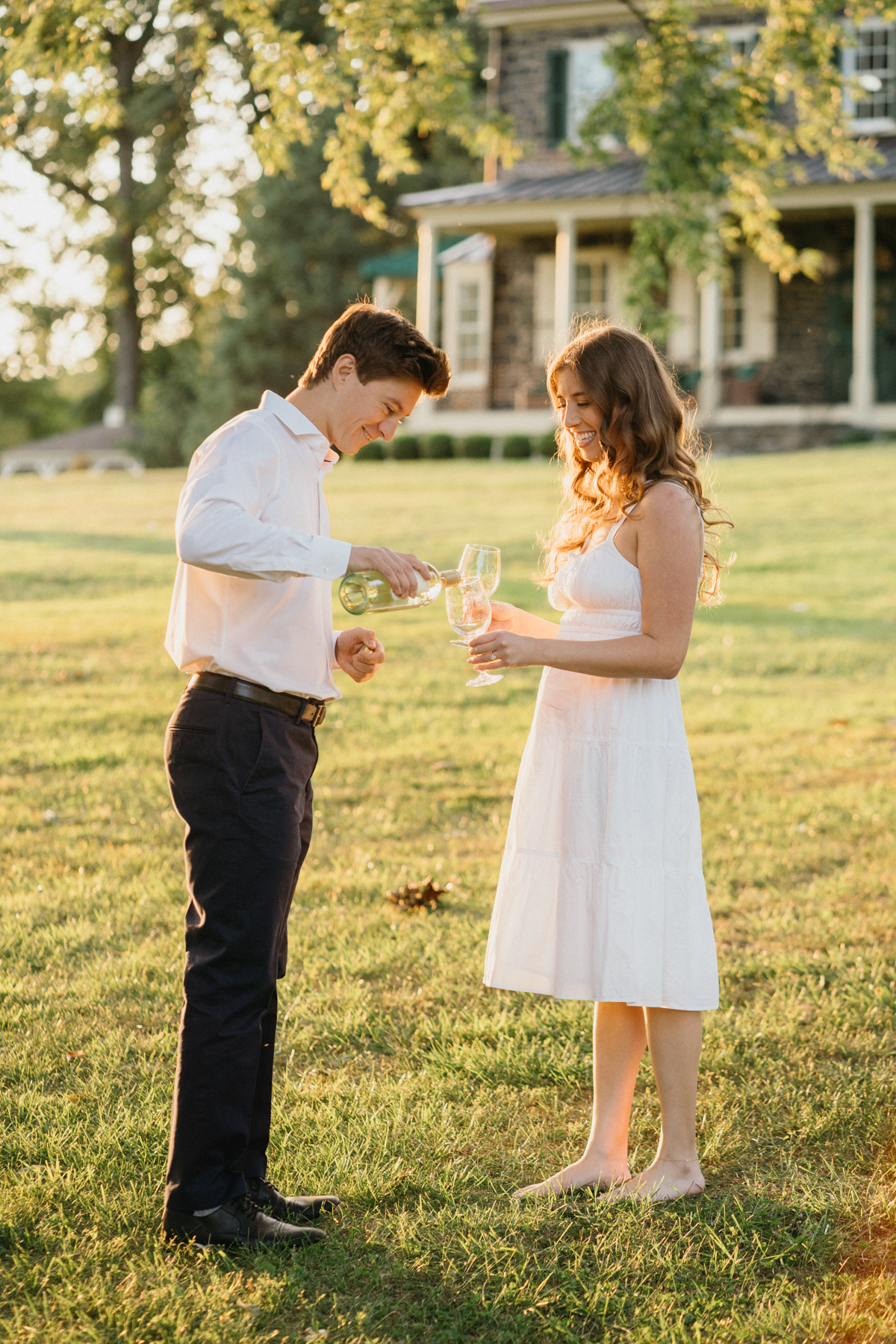 engagement photos at grace winery with champagne